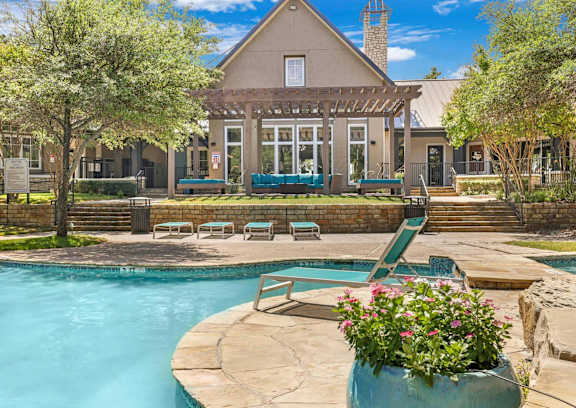A house with a pool in the backyard.