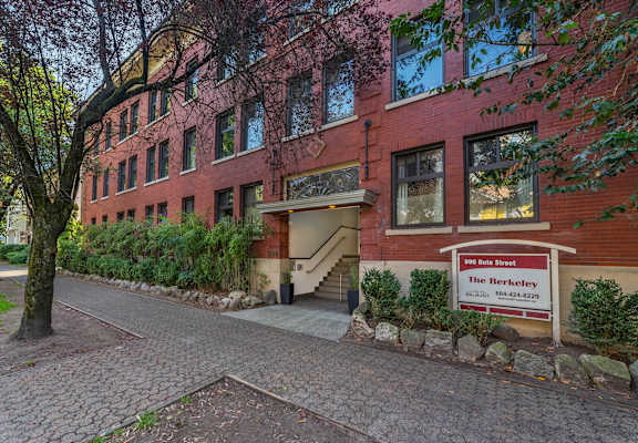 A red brick building with a sign that says "The Berkeley".
