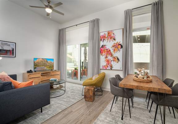 an open living room and dining room with a table and chairs at Vista Brooklynn Apartments, Florida, 32202