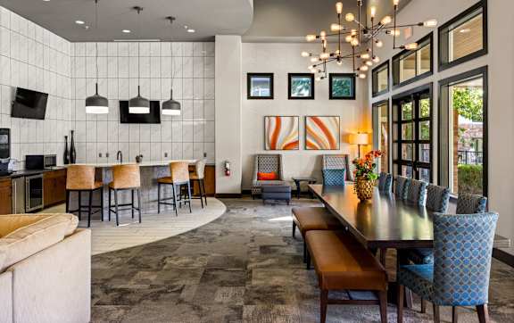 A gym with a red floor and various exercise equipment. at The Royce at 8100, Austin, TX, 78729