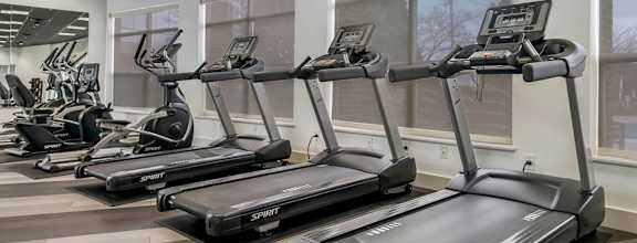 the gym is equipped with treadmills and ellipticals at CityView, North Kansas City, MO, 64116