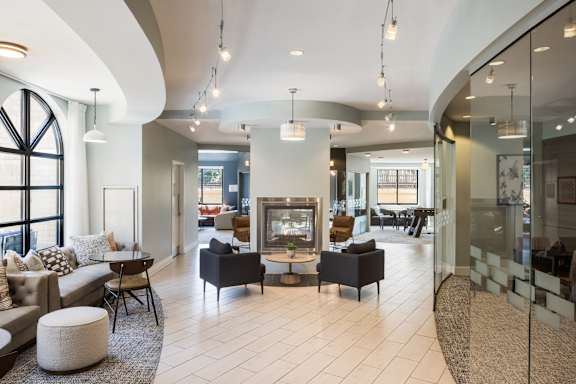 A modern dining room with a table set for four.