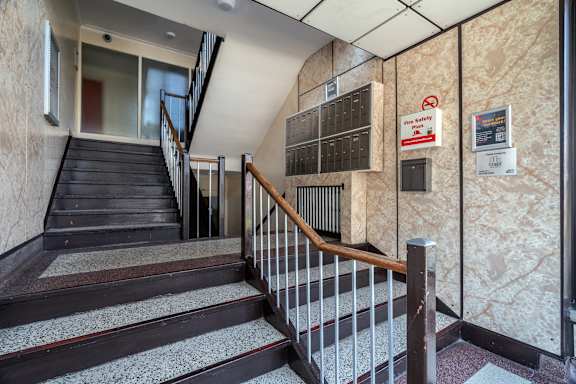 the stairs up to the lobby of a building at 111 Cosburn, East York, ON M4J 2L1