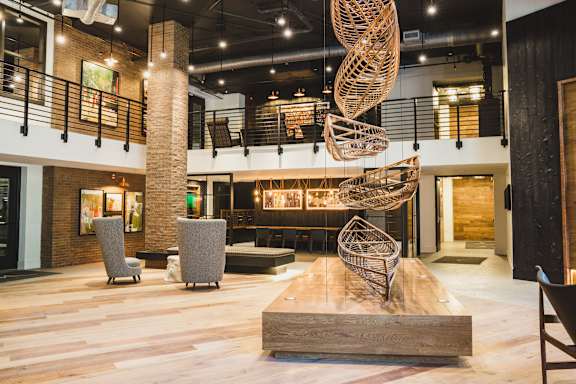 A large room with a spiral sculpture in the middle.