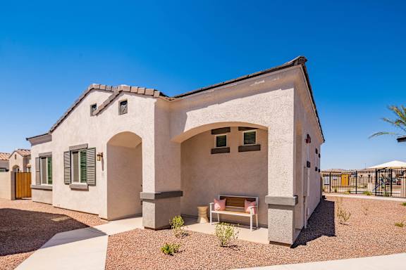 a house with a patio and a table in front of it