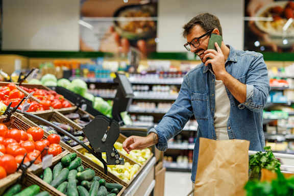 A man in a grocery store at Woodland Place Apartments, British Columbia, L4H 3P6