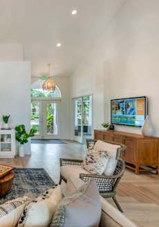 a living room with couches and a tv at The Villas at Ibis Landing, Florida, 33067