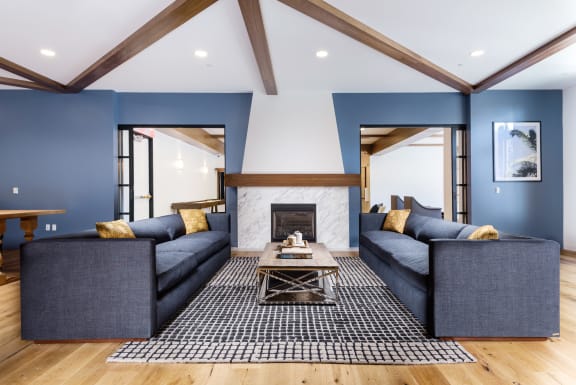 a living room with blue couches and a fireplace  at Mission Hills, Camarillo