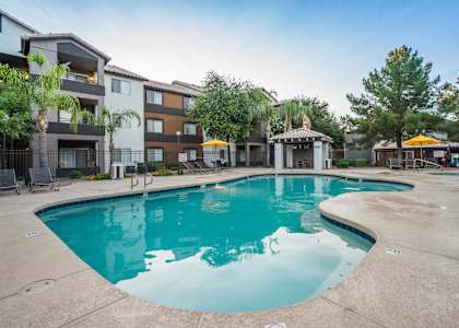 A large swimming pool in front of apartment buildings at Sterling Point Apartment Homes, Phoenix, AZ, 85042