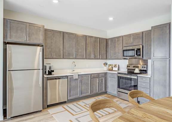 A Kitchen with a Refrigerator at Peregrine Apartments, Minneapolis, 55411