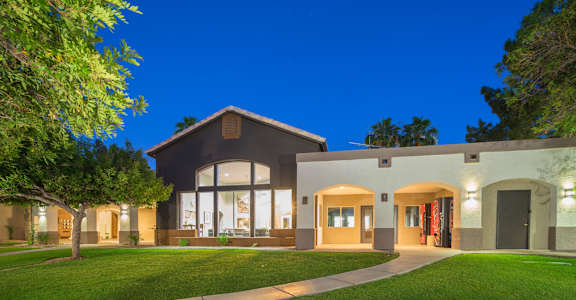 A modern house with a well-lit front yard at Sterling Point Apartment Homes, Phoenix, AZ, 85042