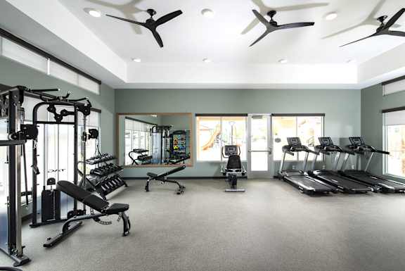 a rendering of a gym with people exercising on treadmills at The Safford, Marana