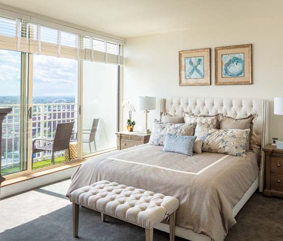 A bedroom with a large bed and a view at Residences Providence, Providence