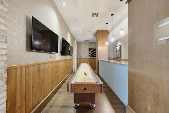 A conference room with a long table and chairs.