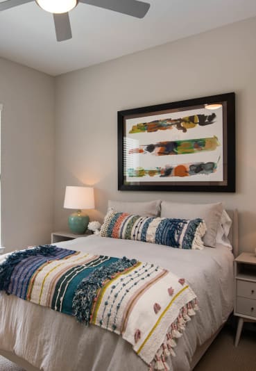 a bedroom with a large window and a bed at One Riverside Apartments, Tennessee, 37403