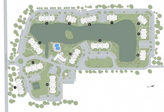 A map of a residential area with roads, houses, and a lake.