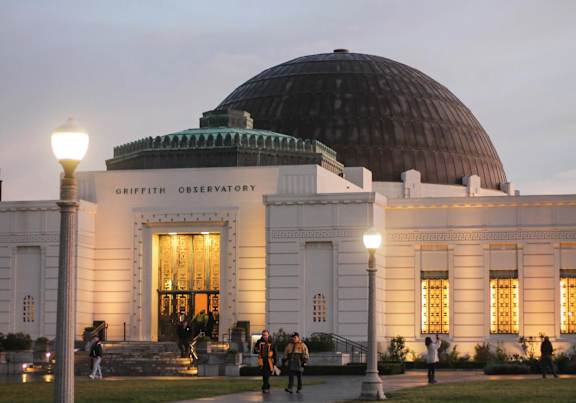 Griffith Observatory is a large, white building with a large dome on top.