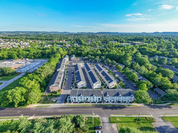 an aerial view of a city with buildings and trees