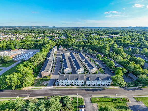 an aerial view of a city with buildings and trees