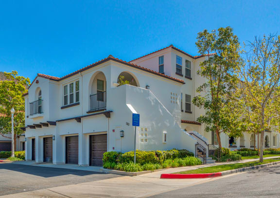 a white building with a street and trees in front of it  at Mission Hills, Camarillo, CA