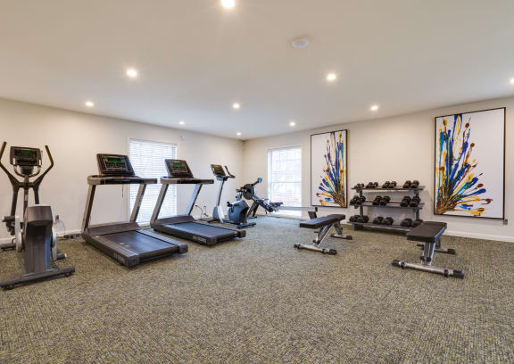 a gym with treadmills and other exercise equipment at Station JTown, Kentucky, 40299