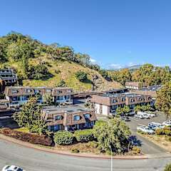 aerial view of apartment buildings and hillside at Posada East Apartments, California, 94949
