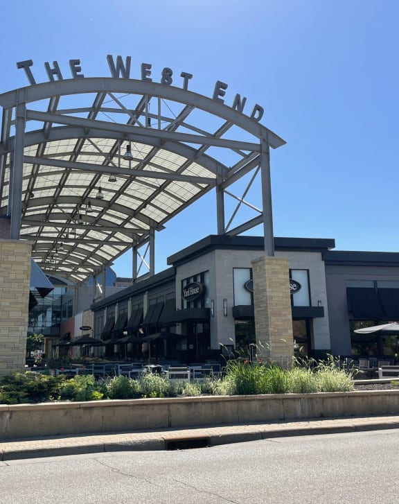 the west end restaurant sign on top of a building at Cityscape, St Louis Park, MN, 55416