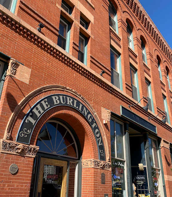 The Burlington pub has a large arched window.