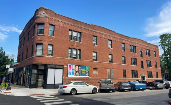 a brick building on the corner of a city street