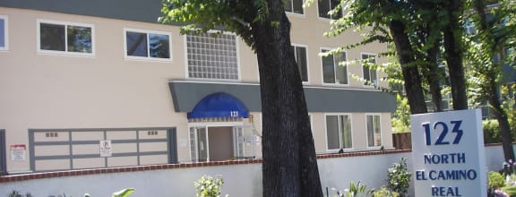 an image of an apartment building with a sign for 121 north el camino real