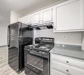 A kitchen with white cabinets at The Ridges Apartments, IA,50315