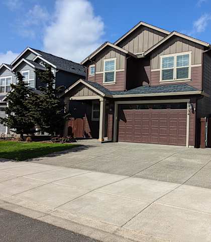 a house with a driveway in front of it