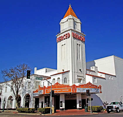 A white building with a red and white striped awning.