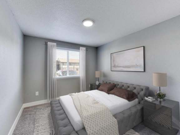 a bedroom with a large bed and a window