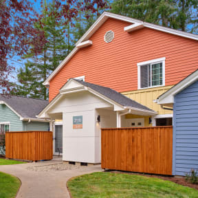 a group of houses with a sidewalk and a fence at Woodcreek, Washington