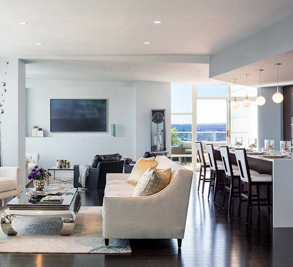 A modern living room with a large window at Residences Providence, Providence, RI