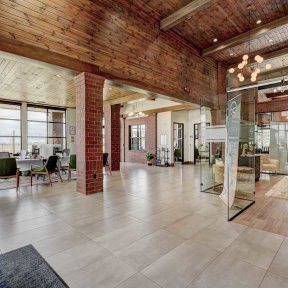 The interior of the entrance of 35 Degrees North with an office, chairs, and coffee tables. 