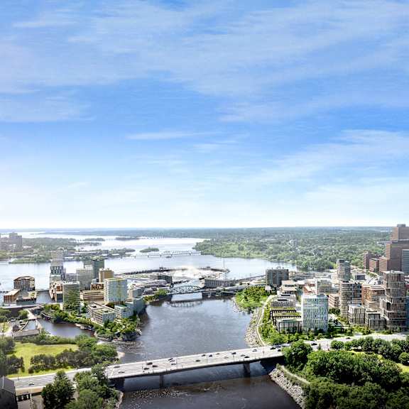A cityscape with a river running through it.