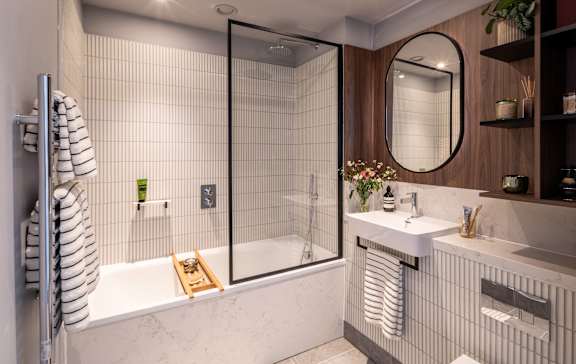 Bathroom in a one-bedroom apartment with walk-in shower.