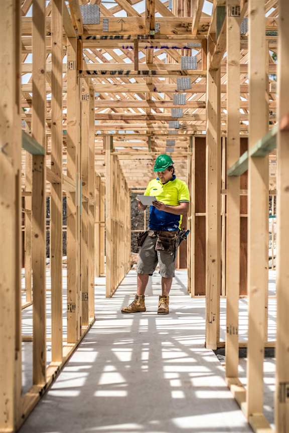 a construction worker working on top of a roof