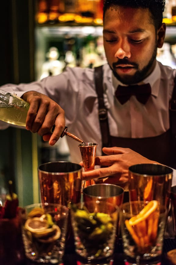 A bartender preparing drinks at The Parker in Portland, 97209
