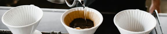Close Up View of Water Being Poured Over Coffee Grounds