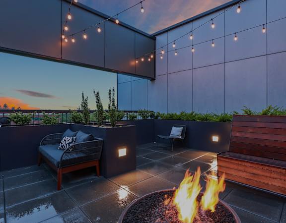 Open air sky-deck with firepit - Willow Apartments