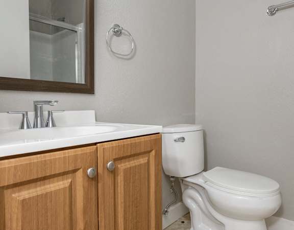 an empty bathroom with a toilet and a sink