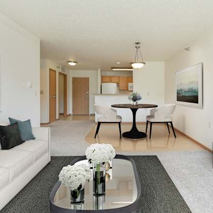 a living room with a couch and a table and a television