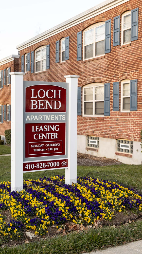 a sign in front of a building at Loch Bend Apartments, Baltimore