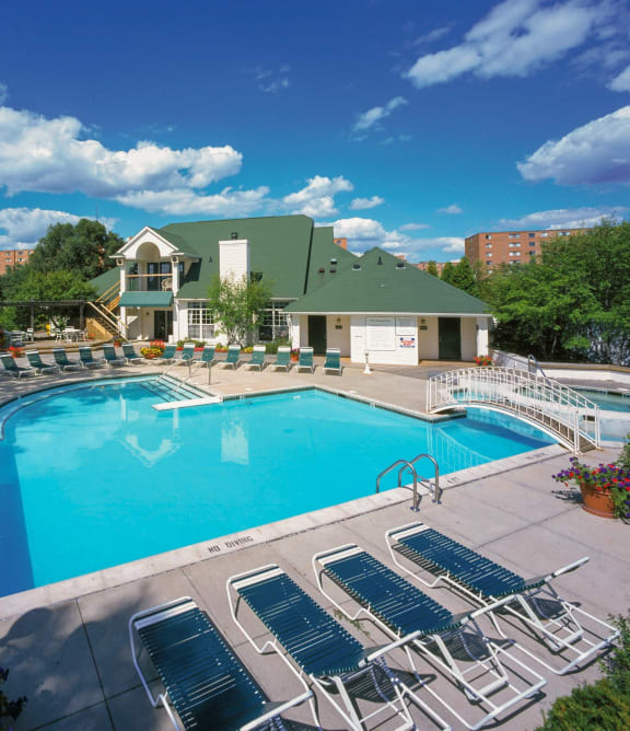 a rendering of a building with a pool and courtyard at night at Village Club on Franklin, Southfield