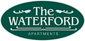 a green sign that reads the waterford apartments