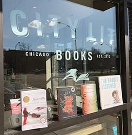 City Lit Book Store window with books stacked up to view.