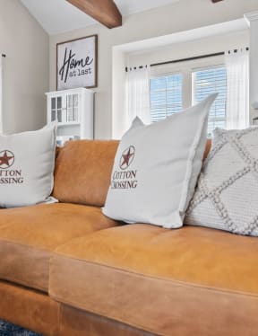 a couch with pillows in a living room